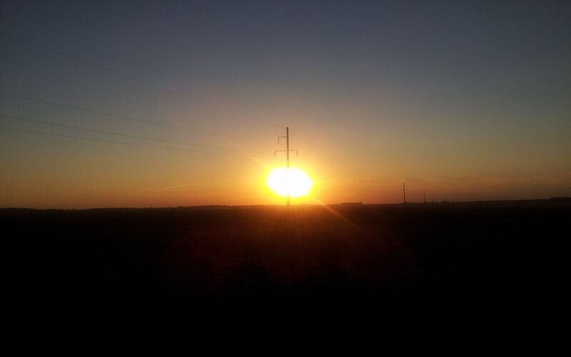 Sun Setting Behind Pole