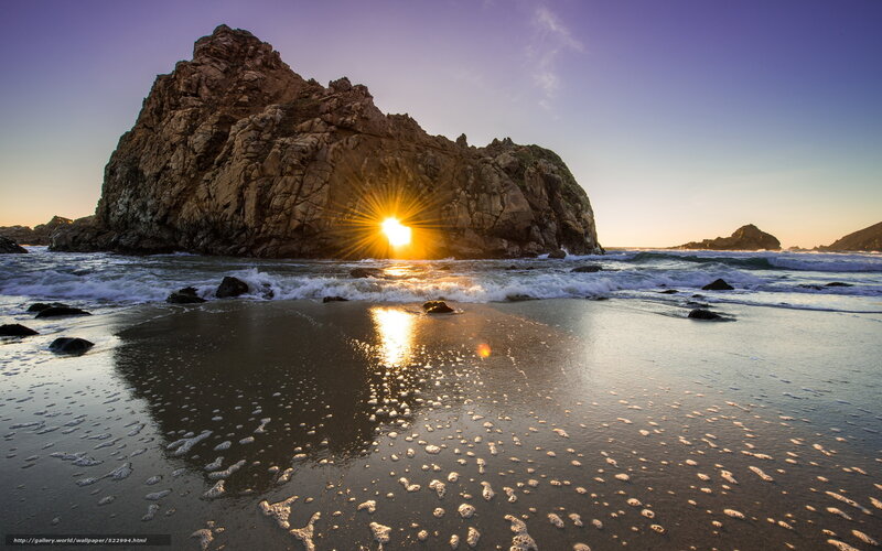 Sun Setting Behind Rock
