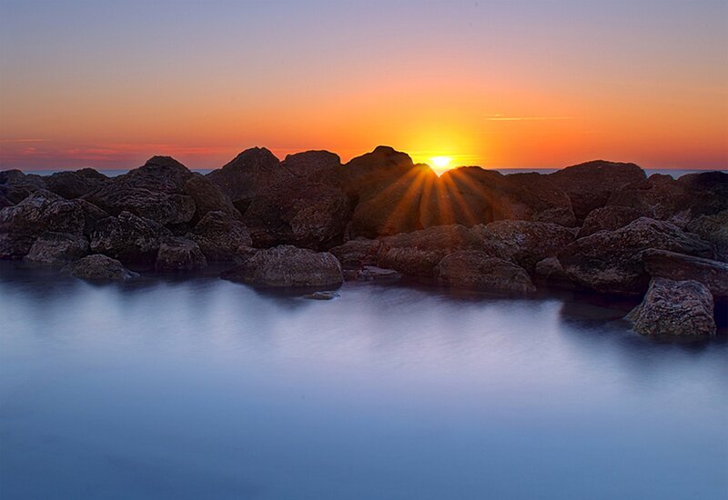 Sun Setting Behind Rocks