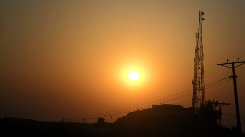 Sun Setting Behind Towers