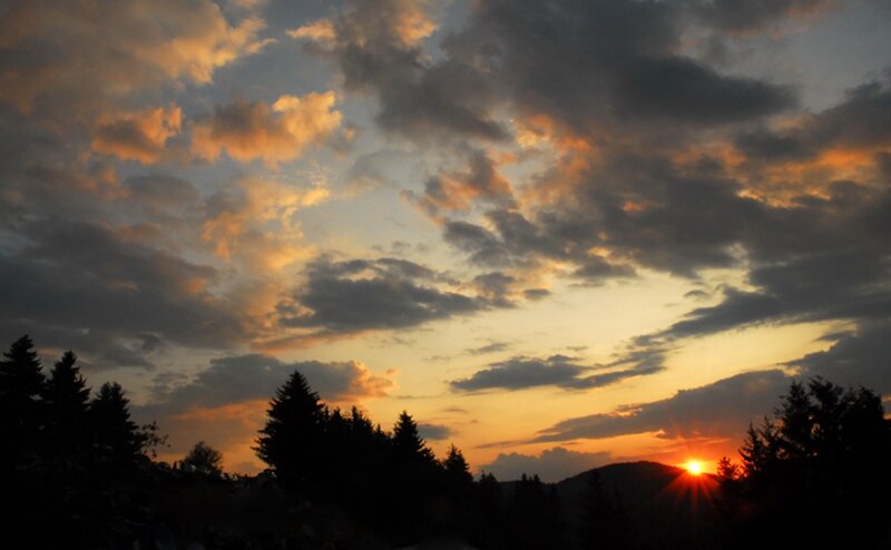 Sun Setting Behind Trees — Orange, Dramatic, Sunset, Photograph, Clouds, Mountain