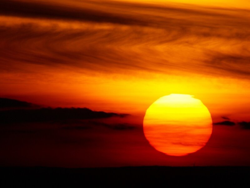 Sun Setting on Horizon — Orange, Dramatic