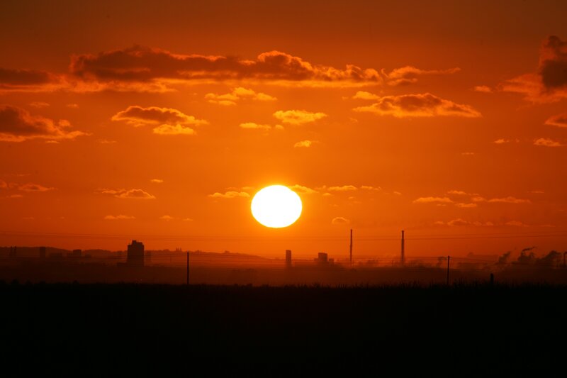 Sun Setting over City — Orange, Dramatic, Sunset