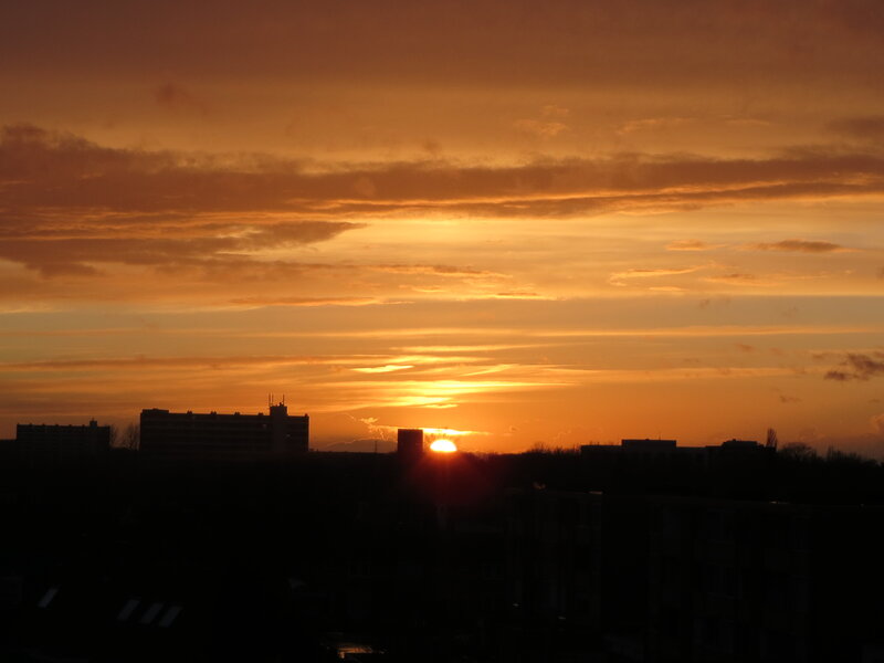 Sun Setting over City — Orange