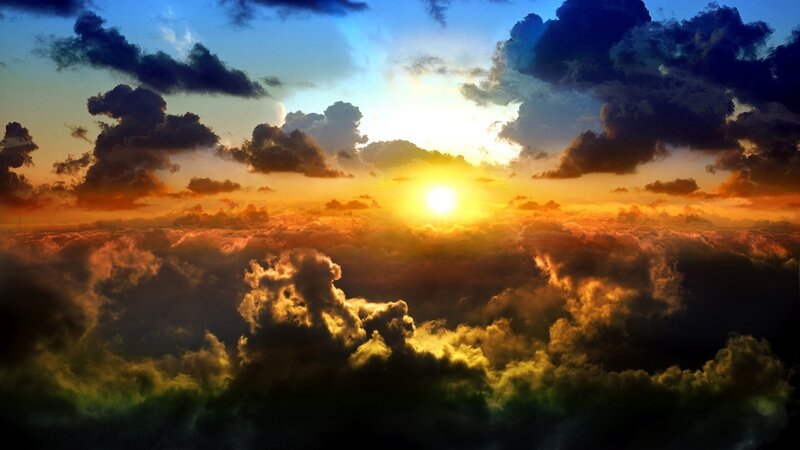 Sun Setting over Clouds