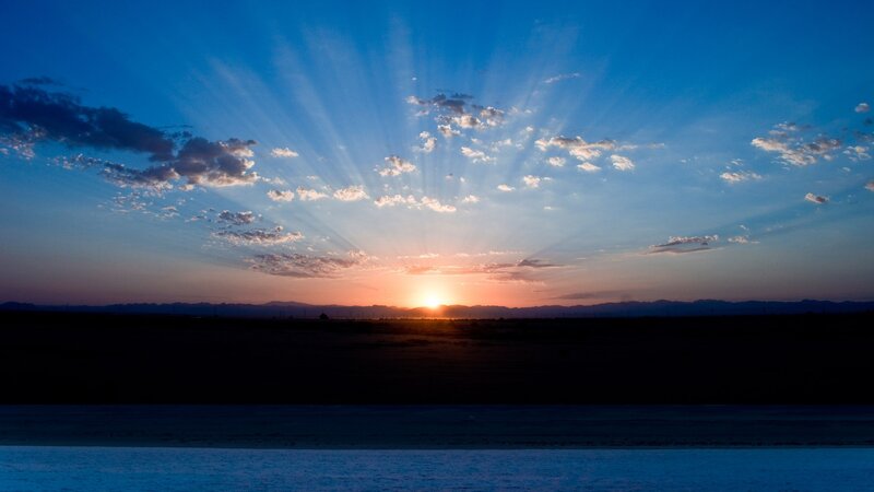 Sun Setting over Desert — Blue