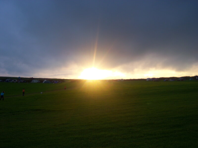 Sun Setting over Field — Green, Dramatic, Sunset, Photograph, People