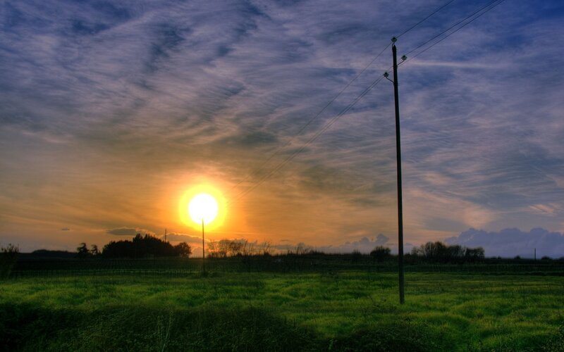 Sun Setting over Field — Green, Serene, Sunset, Photograph, Pole