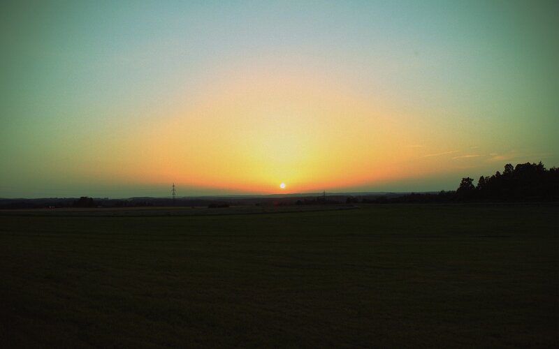 Sun Setting over Field — Green, Serene, Sunset, Photograph