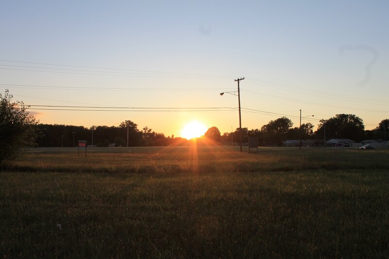 Sun Setting over Field — Orange, Serene, Sunset, Photograph, Trees, Power Lines