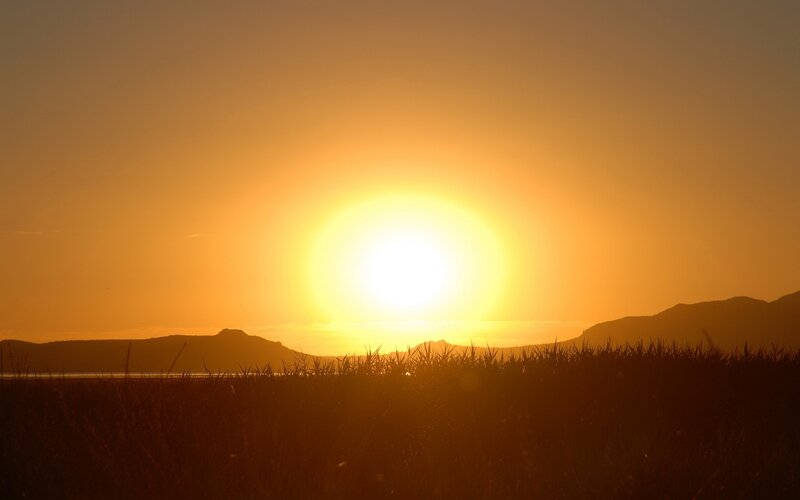 Sun Setting over Hills — Orange, Serene, Sunset, Photograph, Grass, Sky