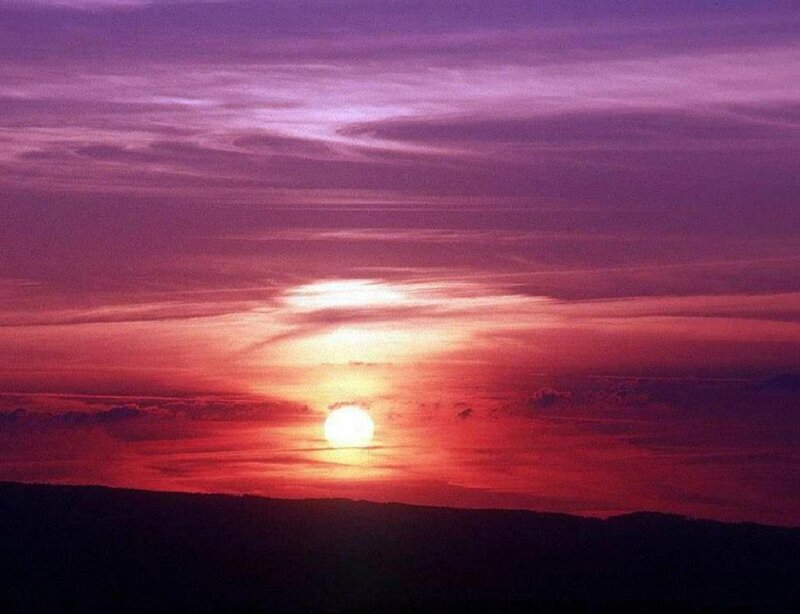 Sun Setting over Hills — Purple
