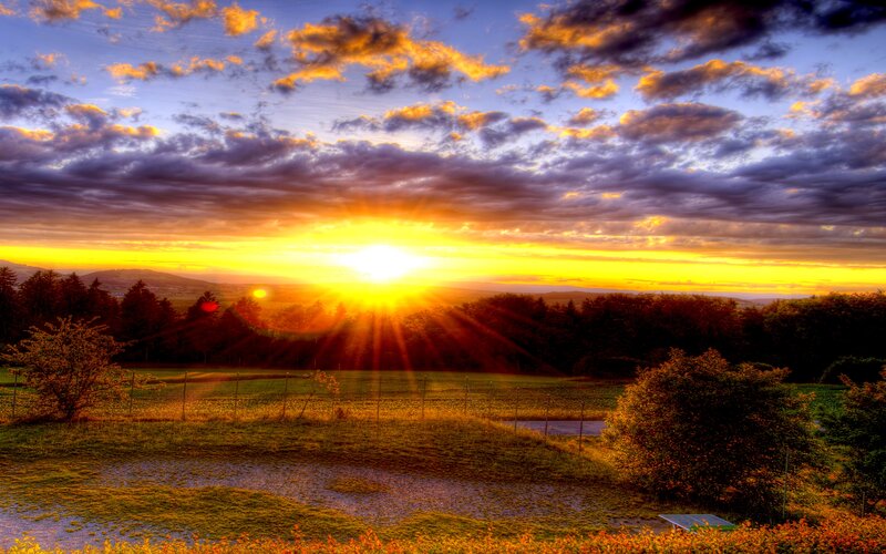 Sun Setting over Hills — Yellow, Dramatic