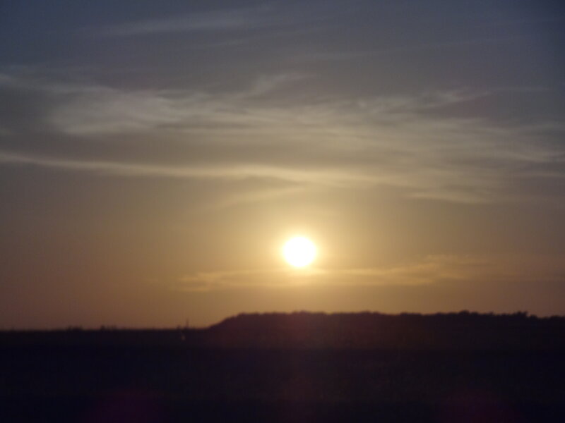 Sun Setting over Hills — Yellow