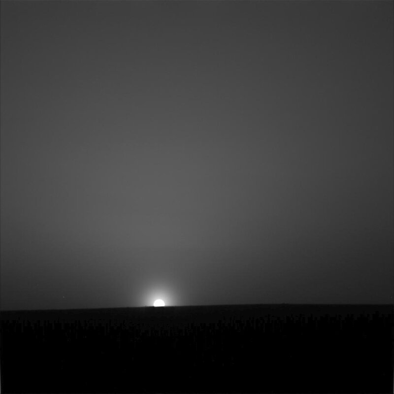 Sun Setting over Horizon — Black