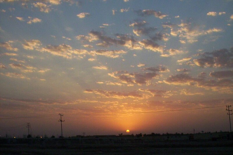 Sun Setting over Horizon — Orange