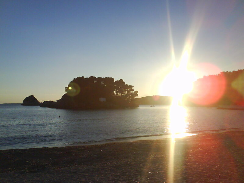 Sun Setting over Island — Blue