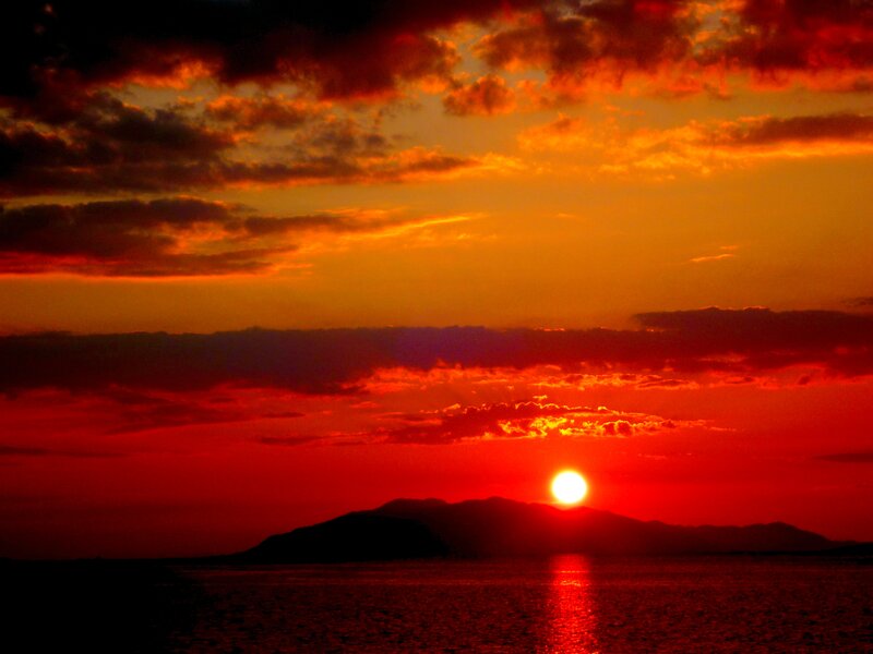 Sun Setting over Island — Red