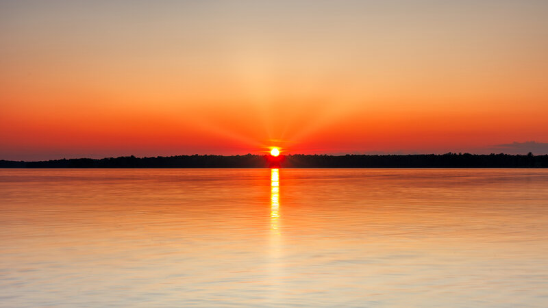 Sun Setting over Lake — Orange, Serene, Sunset, Photograph, Sky, Trees, Reflection