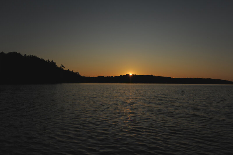 Sun Setting over Lake — Orange