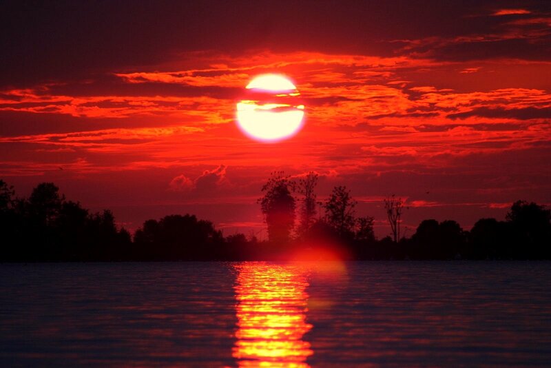 Sun Setting over Lake — Red