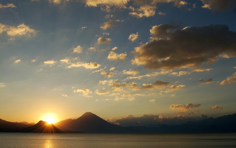 Sun Setting over Mountain — Blue