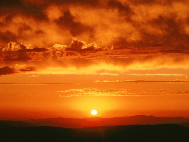 Sun Setting over Mountains — Dramatic