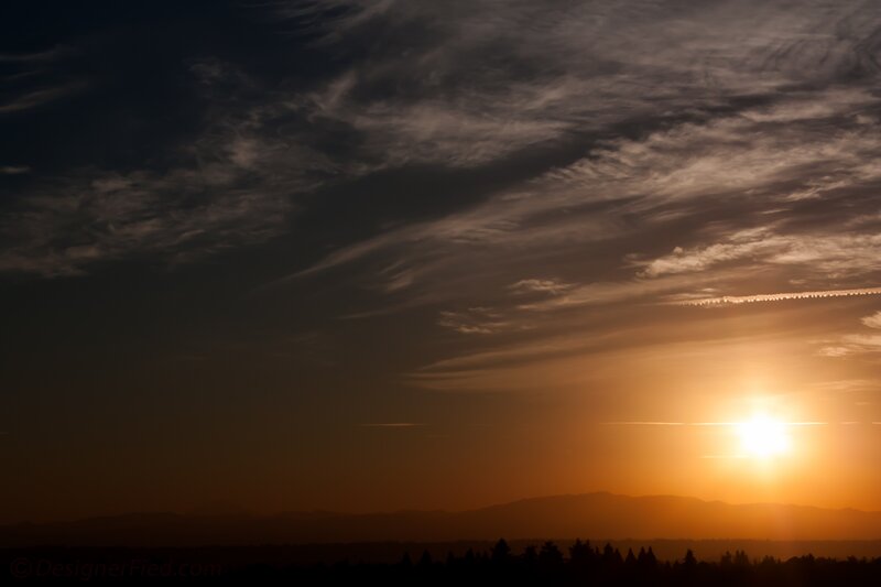 Sun Setting over Mountains — Orange, Dramatic, Sunset, Photograph, Clouds, Trees, Black