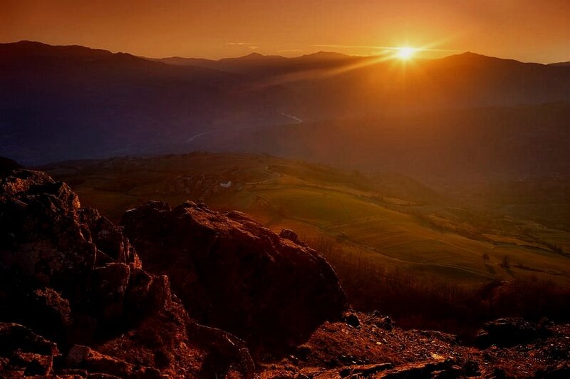 Sun Setting over Mountains — Orange