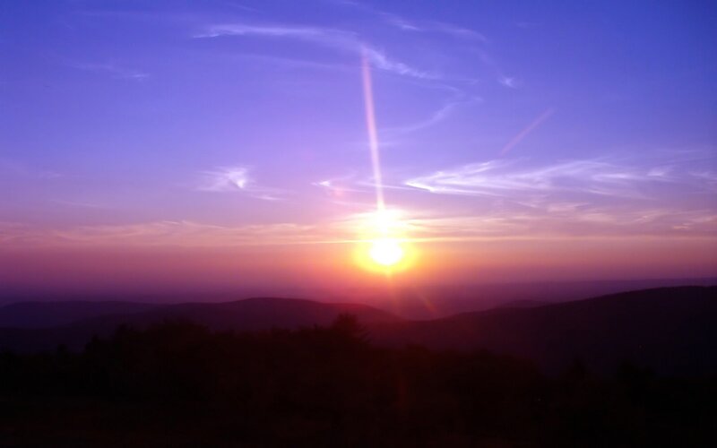 Sun Setting over Mountains — Purple