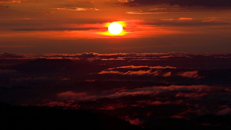 Sun Setting over Mountains — Red, Dramatic