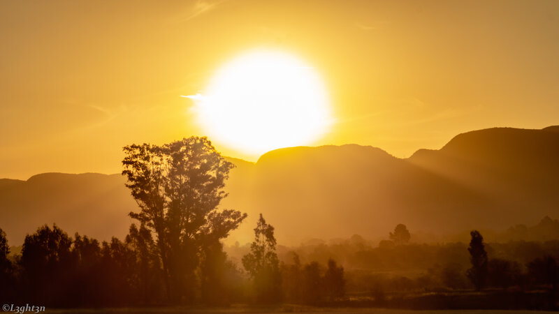 Sun Setting over Mountains — Yellow