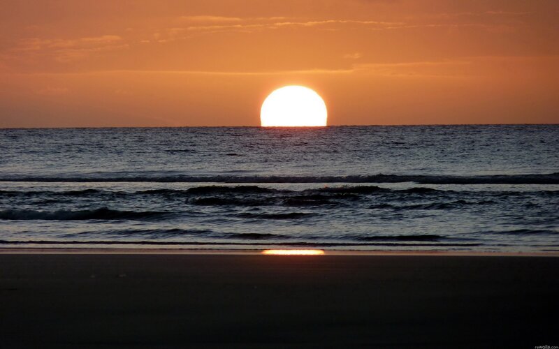 Sun Setting over Ocean — Beach