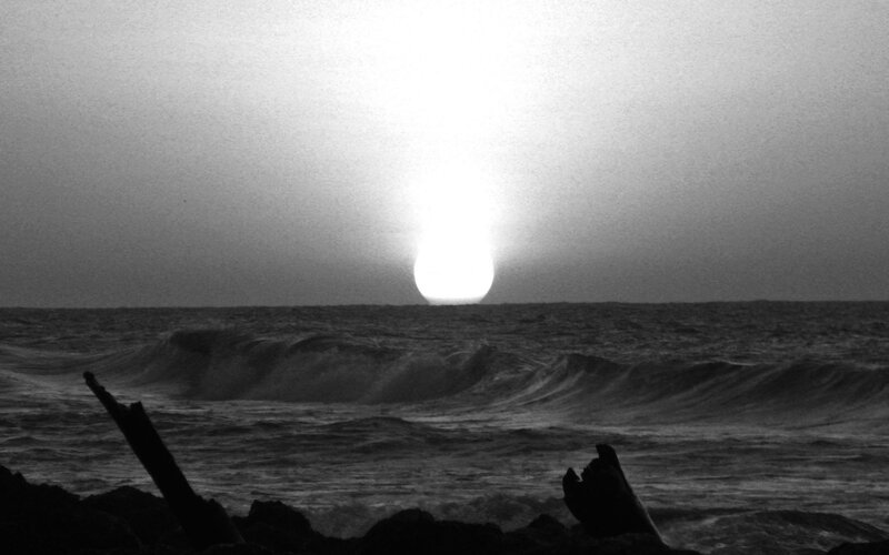 Sun Setting over Ocean — Black