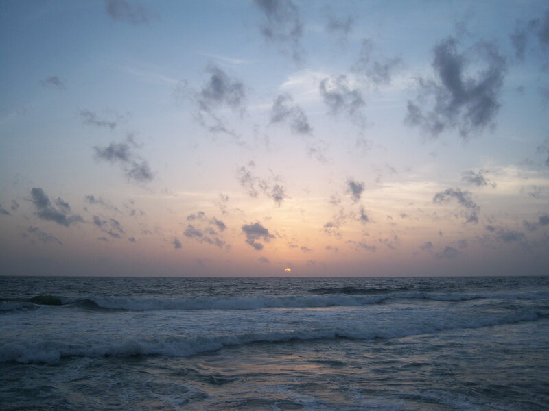 Sun Setting over Ocean — Blue, Calm