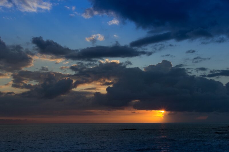 Sun Setting over Ocean — Blue, Dramatic, Sunset, Photograph, Clouds, Orange, Dark Gray