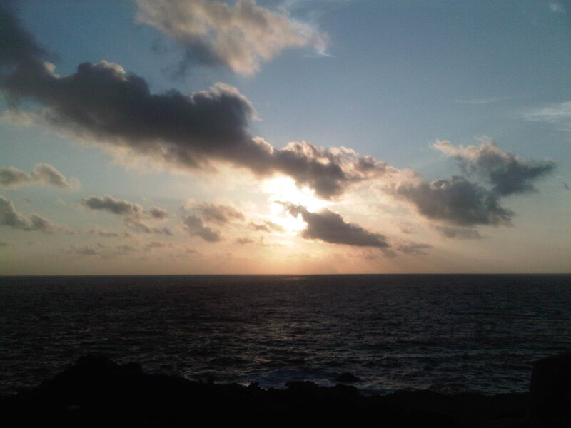 Sun Setting over Ocean — Blue, Dramatic, Sunset, Photograph, Clouds, Rocks