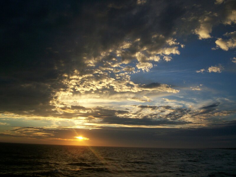Sun Setting over Ocean — Blue, Dramatic, Sunset, Photograph, Clouds, Sea, Yellow