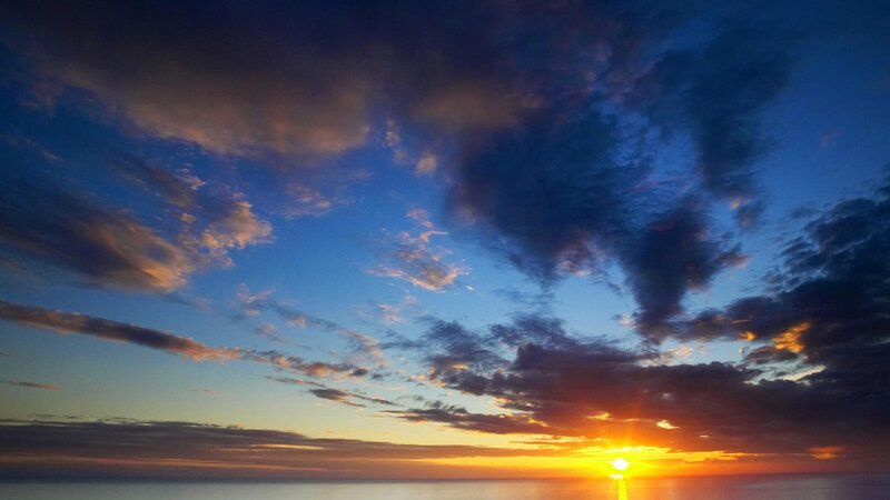 Sun Setting over Ocean — Blue, Dramatic, Sunset, Photograph, Clouds, Sky