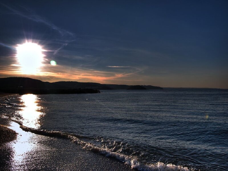 Sun Setting over Ocean — Blue, Serene, Sunset, Photograph, Beach, Hills
