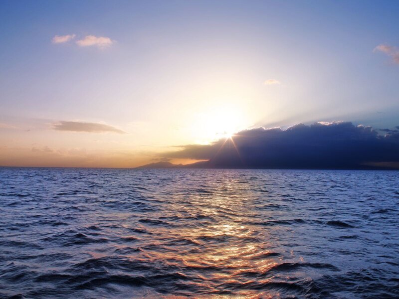 Sun Setting over Ocean — Blue, Serene, Sunset, Photograph, Clouds, Mountain, Sea
