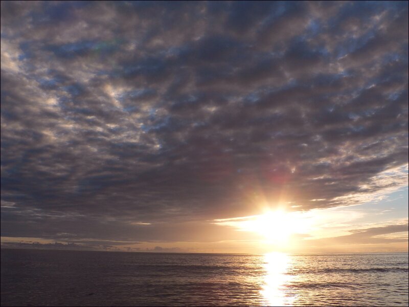 Sun Setting over Ocean — Blue, Serene, Sunset, Photograph, Clouds, Orange, Gray