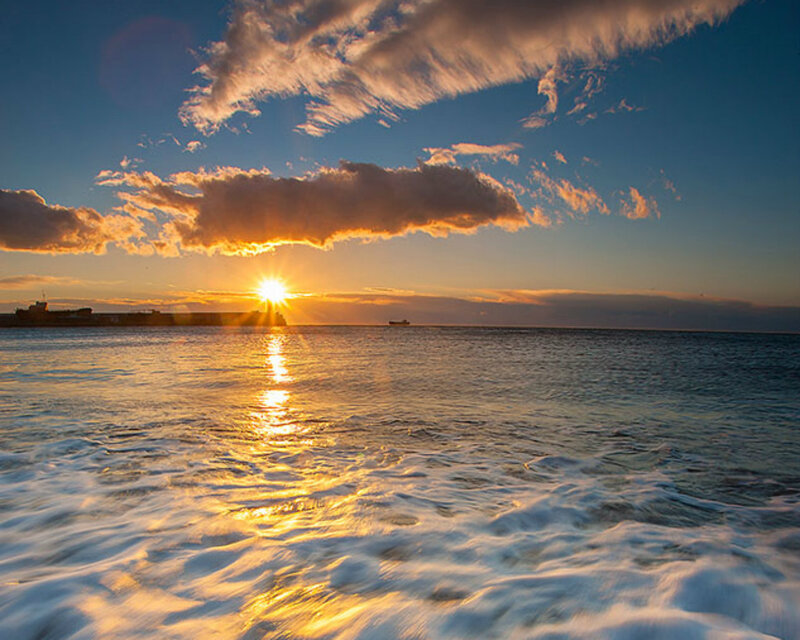 Sun Setting over Ocean — Blue, Serene, Sunset, Photograph, Clouds, Ship