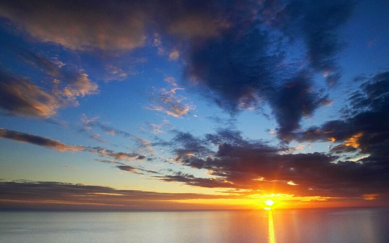 Sun Setting over Ocean — Blue, Serene, Sunset, Photograph, Clouds, Sky, Sea, Orange, Yellow