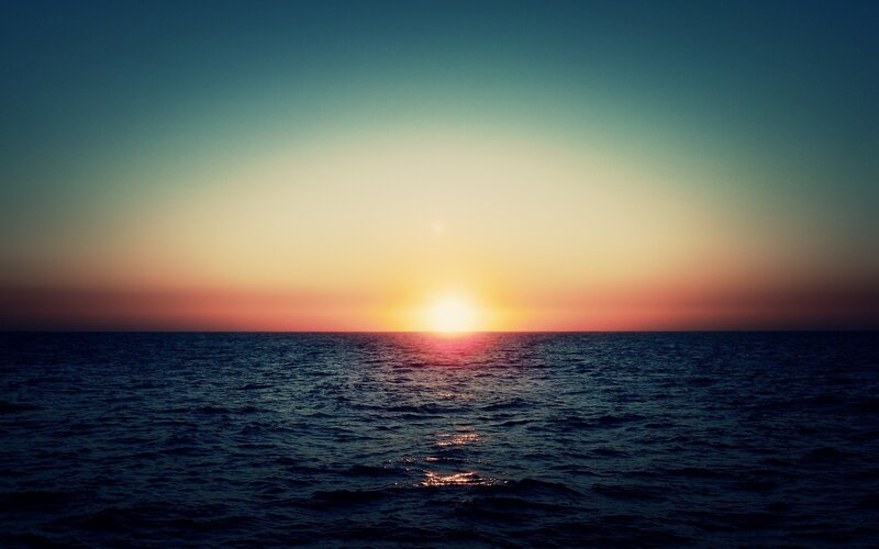 Sun Setting over Ocean — Blue, Serene, Sunset, Photograph, Horizon