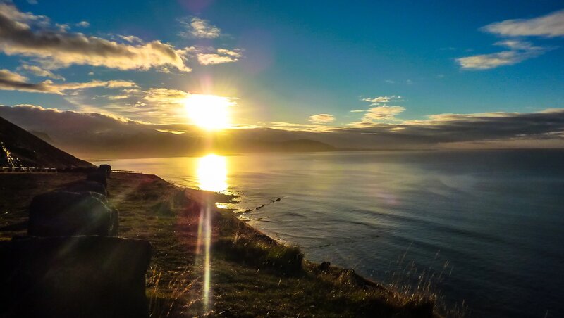 Sun Setting over Ocean — Blue, Serene, Sunset, Photograph, Mountain