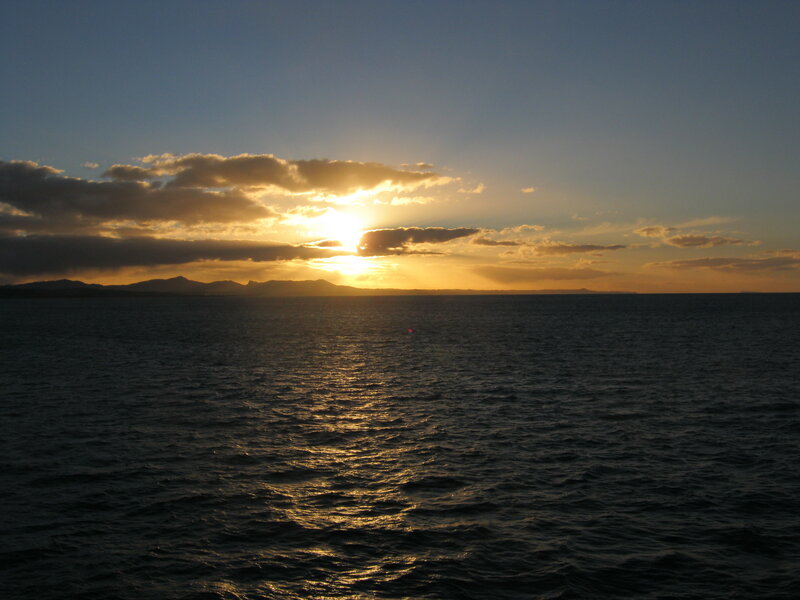 Sun Setting over Ocean — Blue, Serene, Sunset