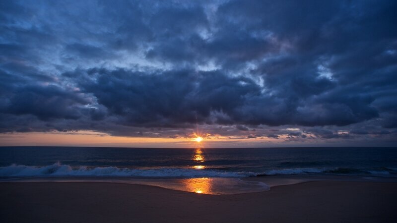 Sun Setting over Ocean — Blue, Waves