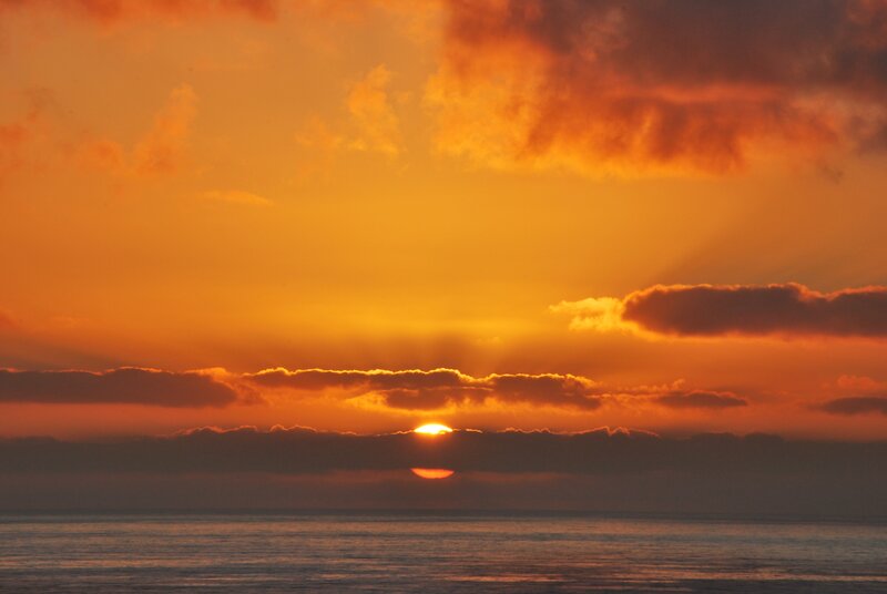 Sun Setting over Ocean — Dark Gray