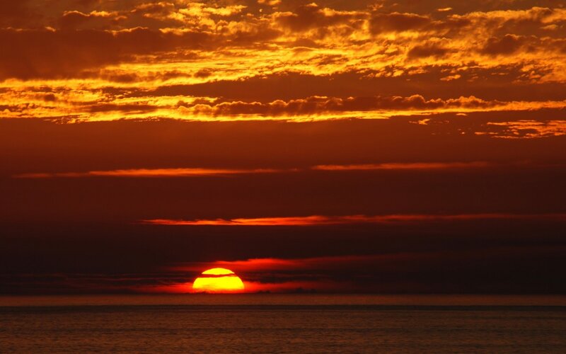 Sun Setting over Ocean — Dramatic, Photograph